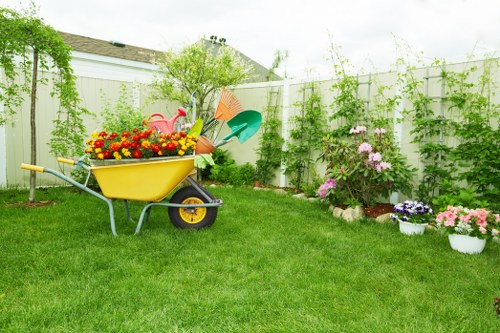 Garden clearance work in Cowley with overgrown plants and debris being removed